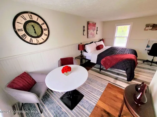 a view of a livingroom with furniture and a fireplace