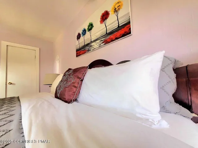 a view of a backyard with a garden and entertaining space