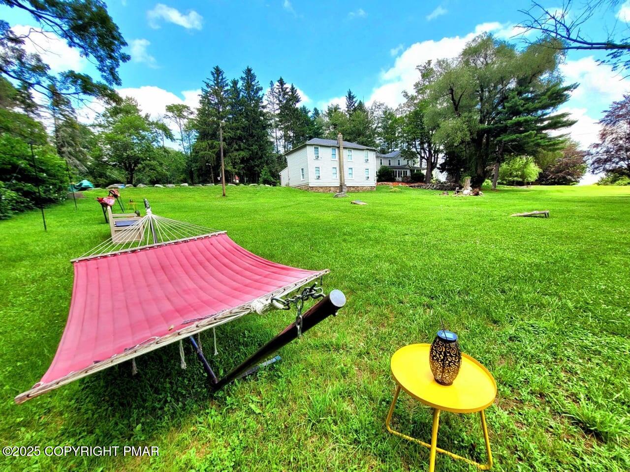 2735 Highway 390 Canadensis, PA 18325 - Photo 49 of 55 a view of a backyard with a garden and entertaining space