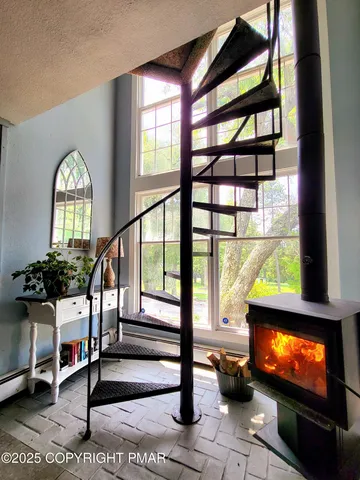 a view of entryway livingroom and hall with wooden floor