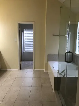 a bathroom with a double vanity sink and mirror