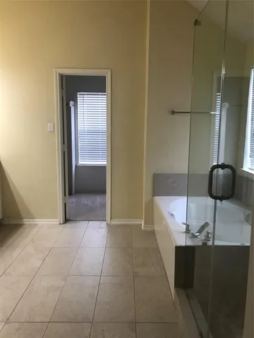 a bathroom with a double vanity sink and mirror