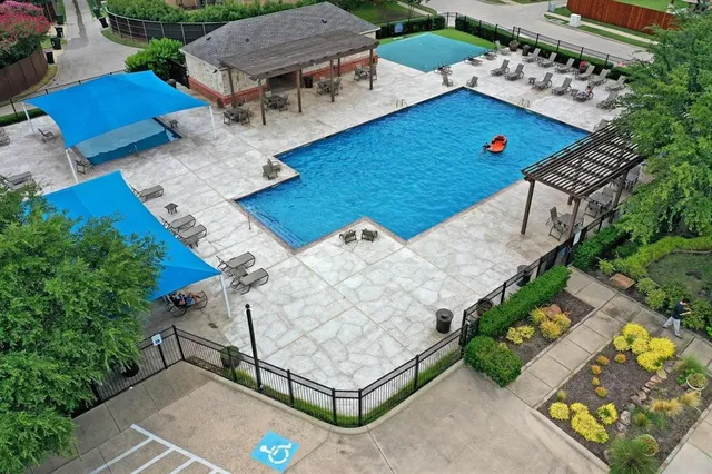 an aerial view of a house with a garden and plants