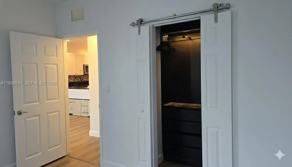 a view of a bathroom from a hallway