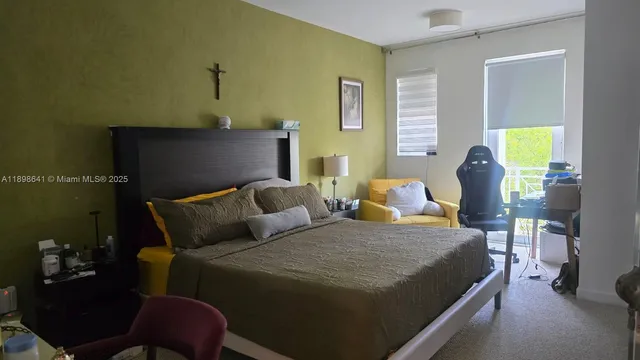a bathroom with a tub sink and a window