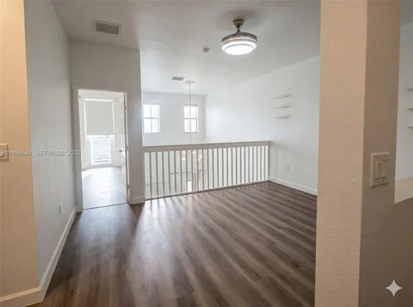 wooden floor in a hall with an entryway