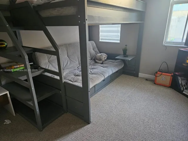 a room with a bed and a window