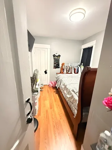 a view of walk in closet with furniture and a window