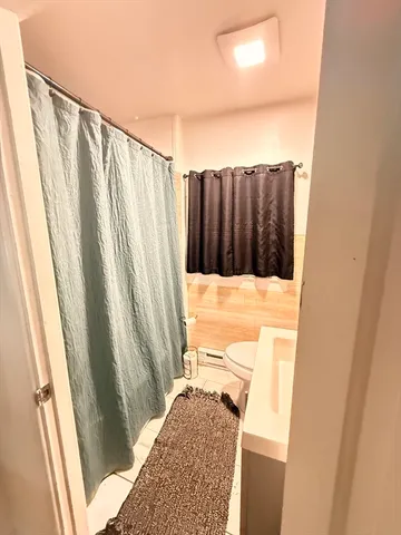 a kitchen with a sink a window and cabinets