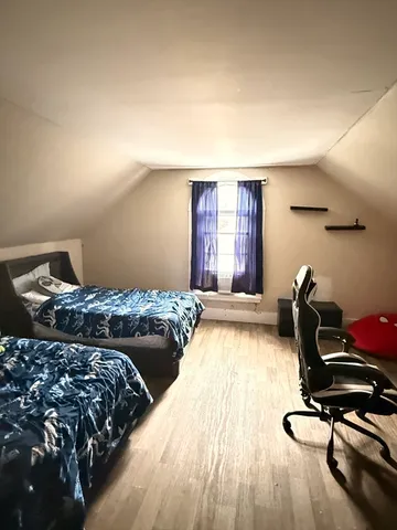 a view of room with toys and wooden floor