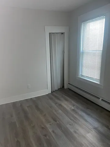 a bathroom with a sink toilet and mirror