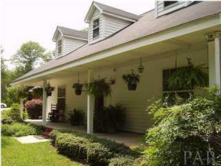 6164 Allentown Road Milton, FL 32570 - Photo 2 of 23 Enjoy a glass of sweet tea on your front porch on those summer evenings!