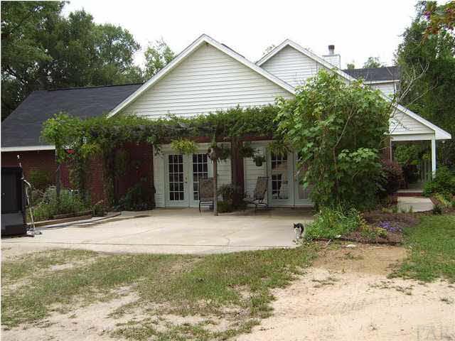 6164 Allentown Road Milton, FL 32570 - Photo 3 of 23 Beautiful garden areas surround this home