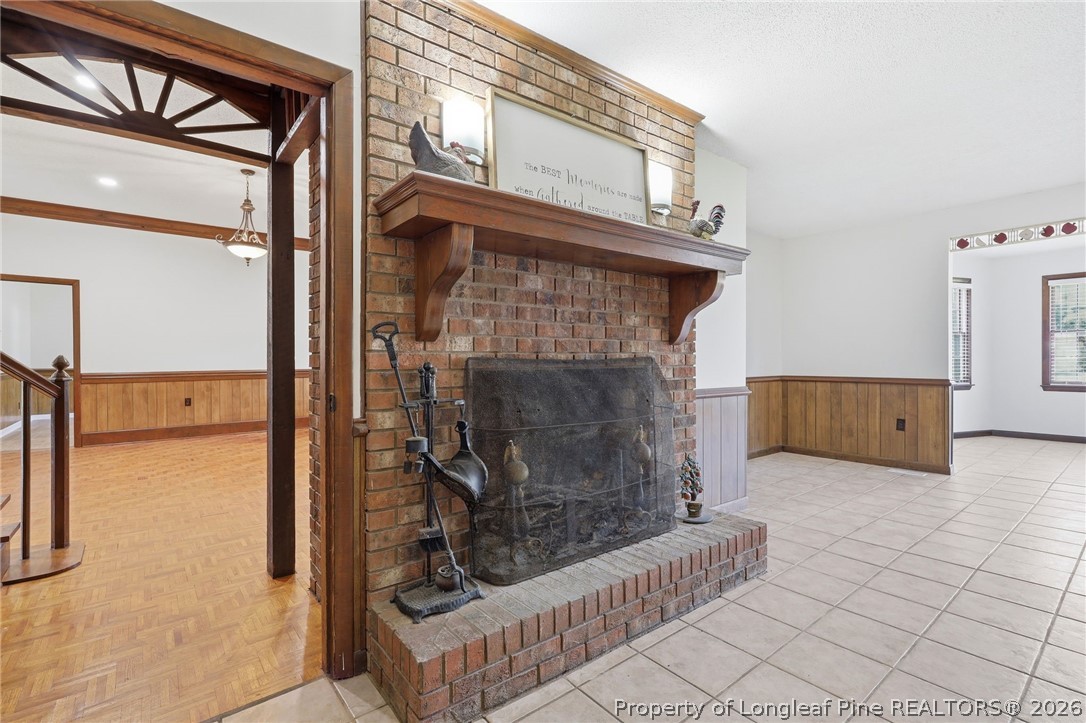 2848 Old Stage Road South Erwin, NC 28339 - Photo 20 of 47 woodturning fireplace in kitchen