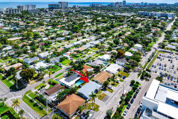 an aerial view of residential houses with outdoor space