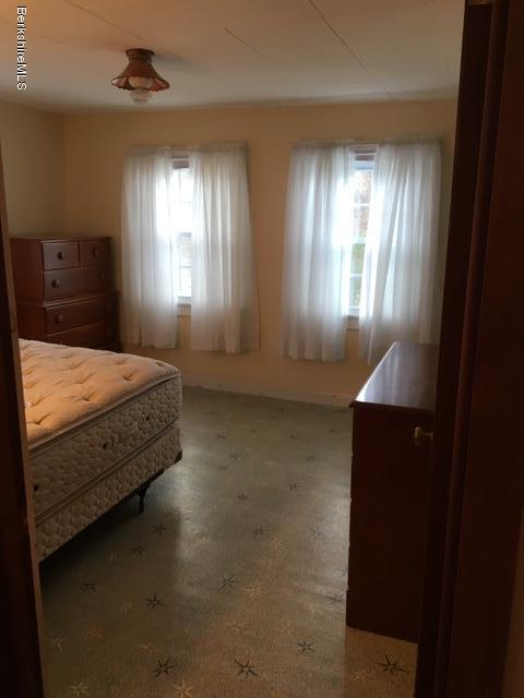 55 Cross Road Clarksburg, MA 01247 - Photo 19 of 22 a spacious bedroom with a bed and a window
