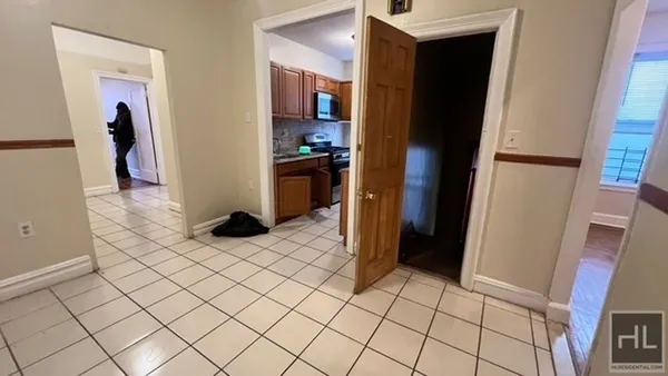 a kitchen with stainless steel appliances a refrigerator and a counter top space