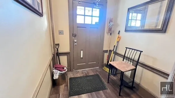 a room with chairs and a window