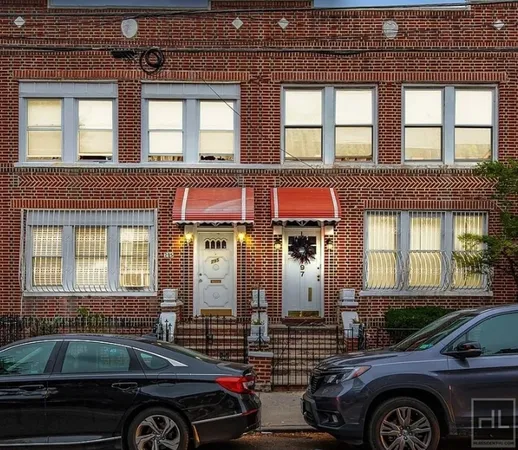 a front view of a house with parking space