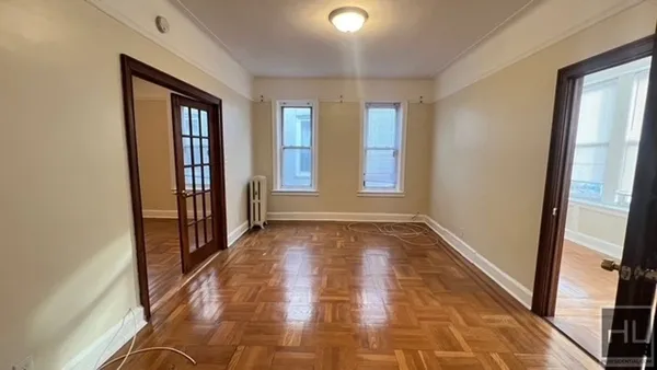 a view of hallway with windows and stairs