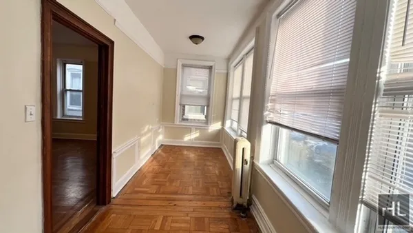 a view of a hallway with windows