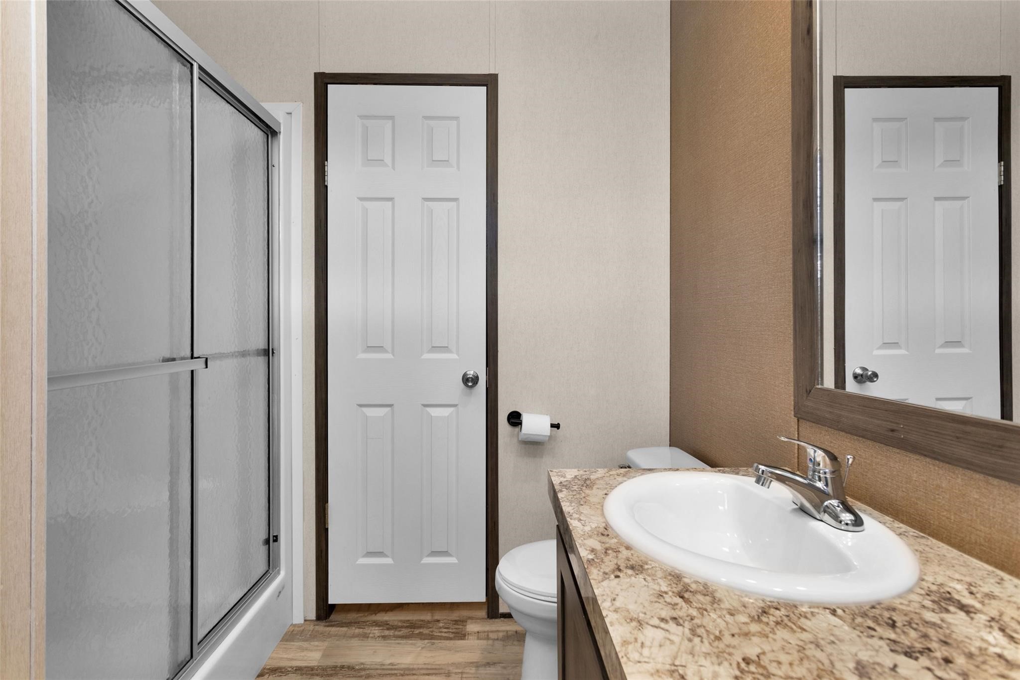 10161 Pollard Road, Unit 1 Willis, TX 77318 - Photo 12 of 22 a bathroom with a sink and a mirror