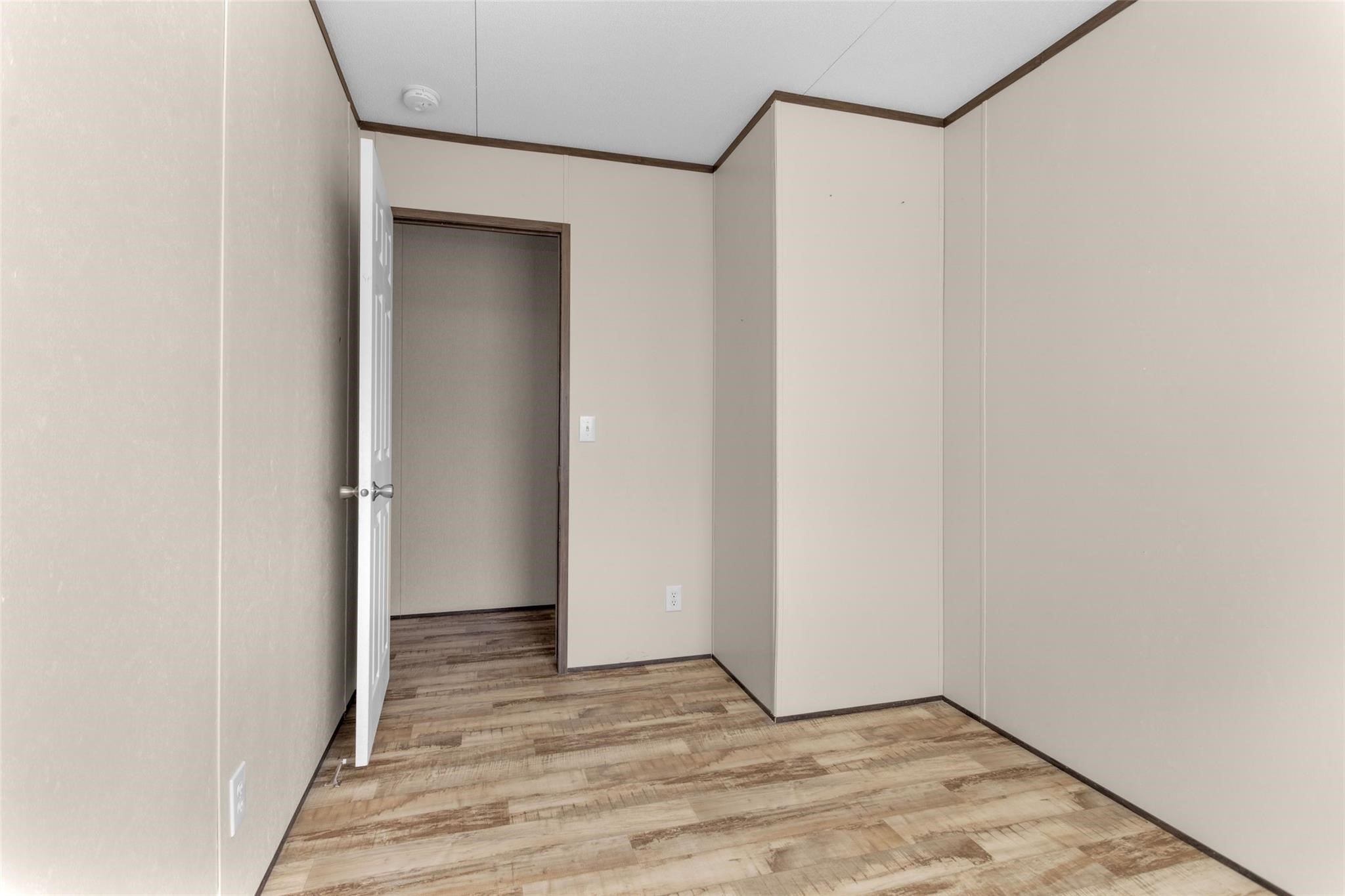 10161 Pollard Road, Unit 1 Willis, TX 77318 - Photo 15 of 22 a view of an empty room with wooden floor