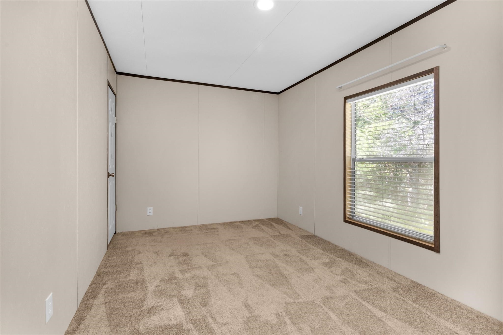 10161 Pollard Road, Unit 1 Willis, TX 77318 - Photo 17 of 22 a view of an empty room with a window