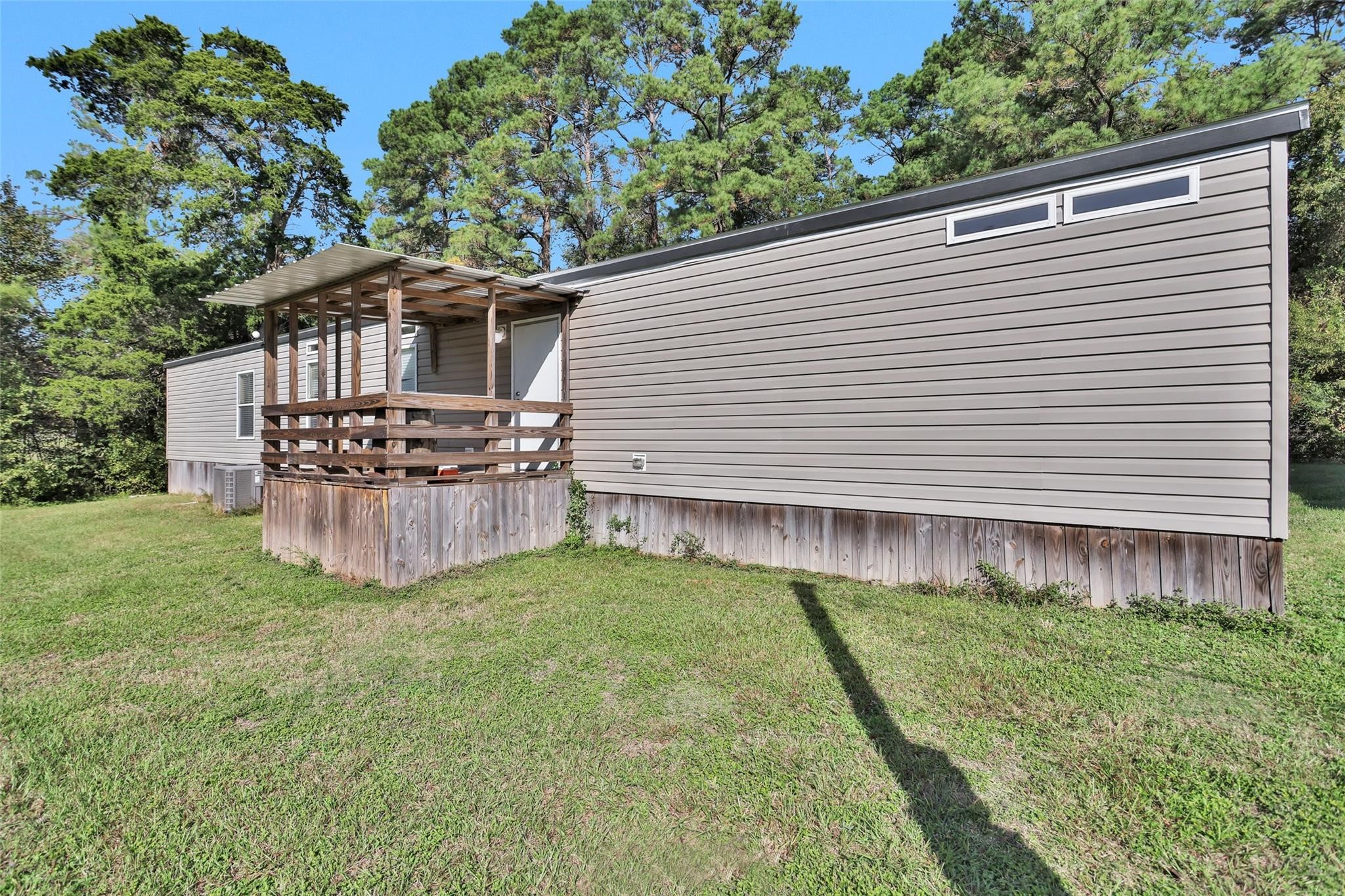 10161 Pollard Road, Unit 1 Willis, TX 77318 - Photo 19 of 22 a view of a house with a backyard
