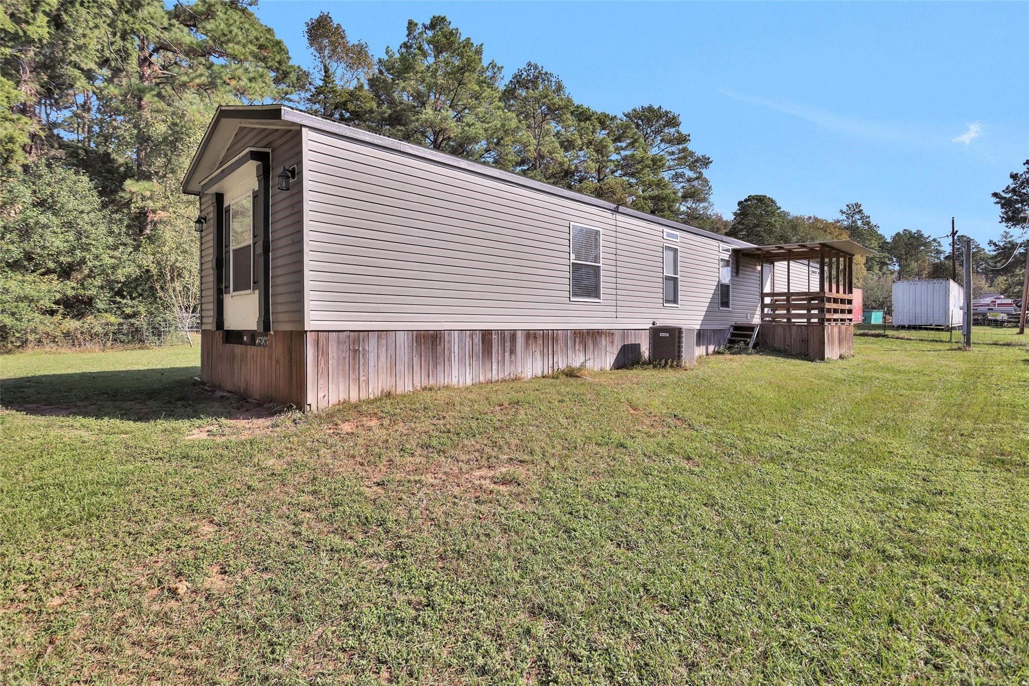 10161 Pollard Road, Unit 1 Willis, TX 77318 - Photo 20 of 22 a view of a house with a yard