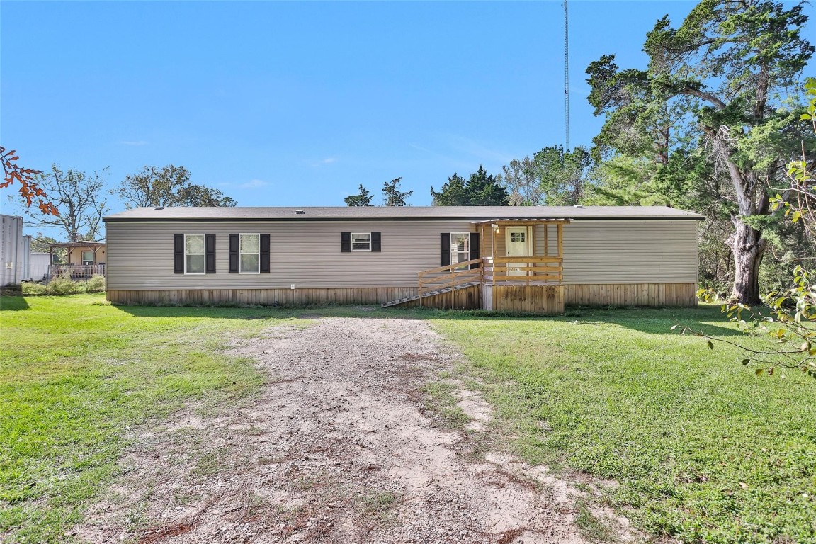 10161 Pollard Road, Unit 1 Willis, TX 77318 - Photo 2 of 22 a house view with a garden space