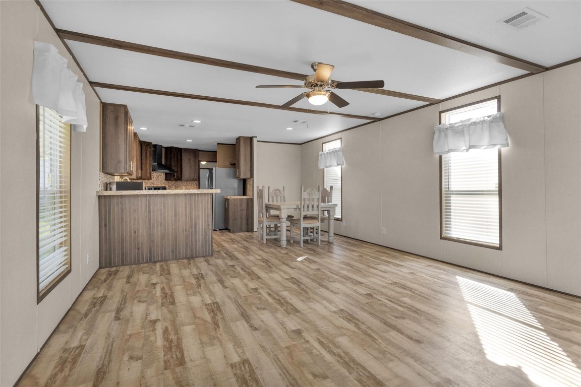 10161 Pollard Road, Unit 1 Willis, TX 77318 - Photo 6 of 22 a room with stainless steel appliances kitchen island granite countertop a refrigerator and a stove top oven
