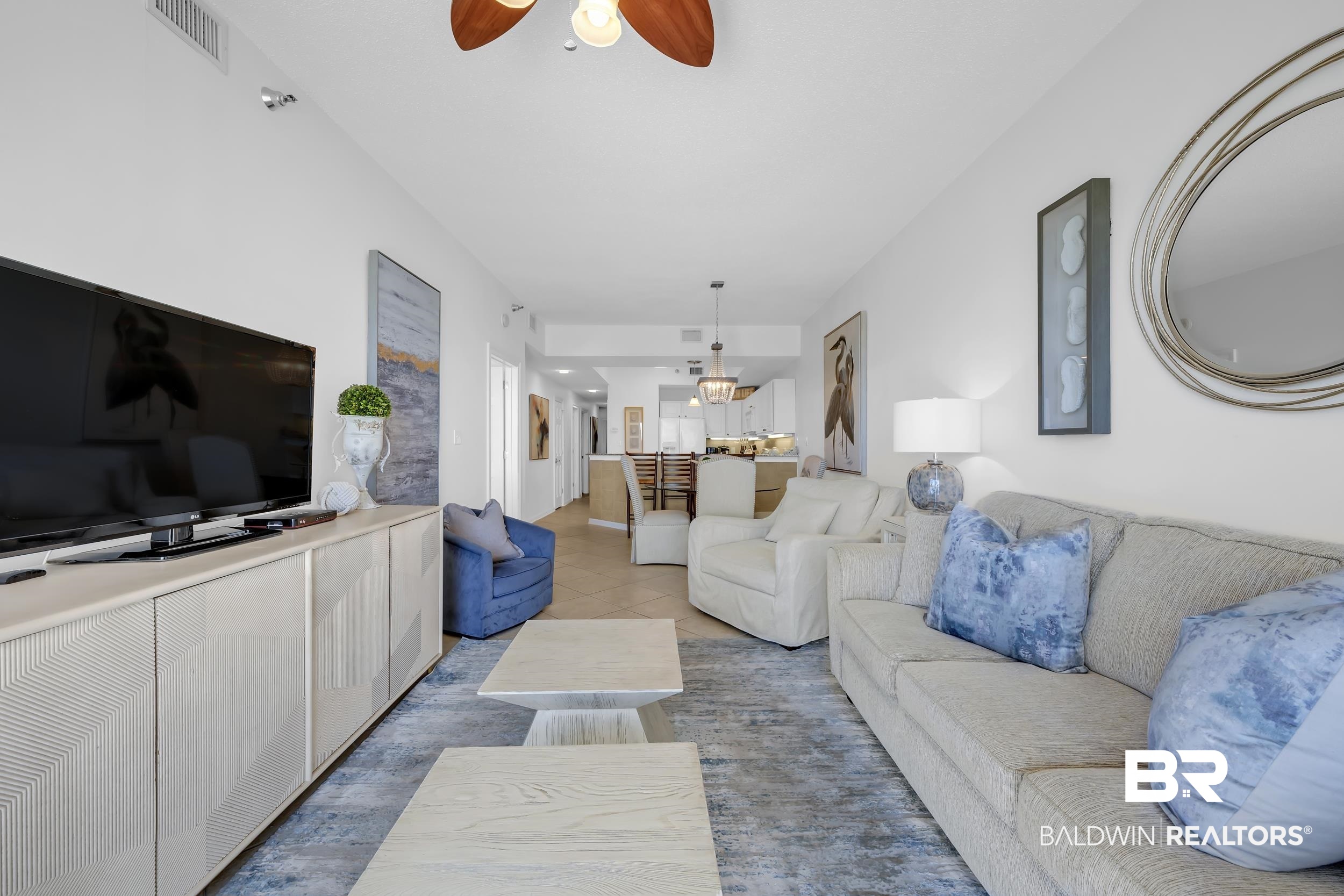 27282 Canal Road, Unit 104 Orange Beach, AL 36561 - Photo 23 of 79 Living area featuring tile patterned floors and ceiling fan
