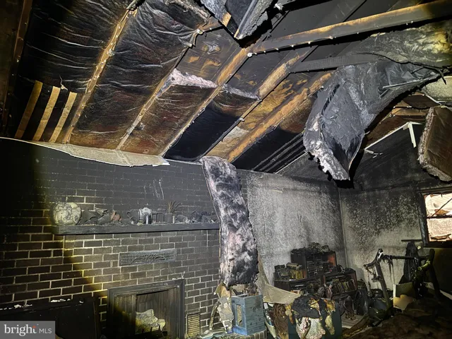 a brick building with black white walls