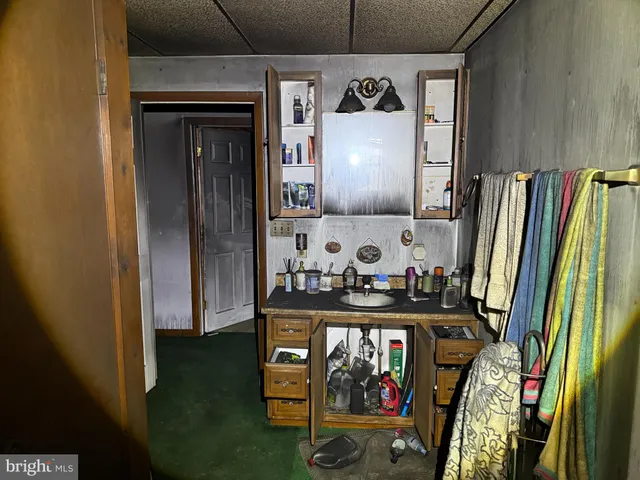 a view of entryway with furniture and rug