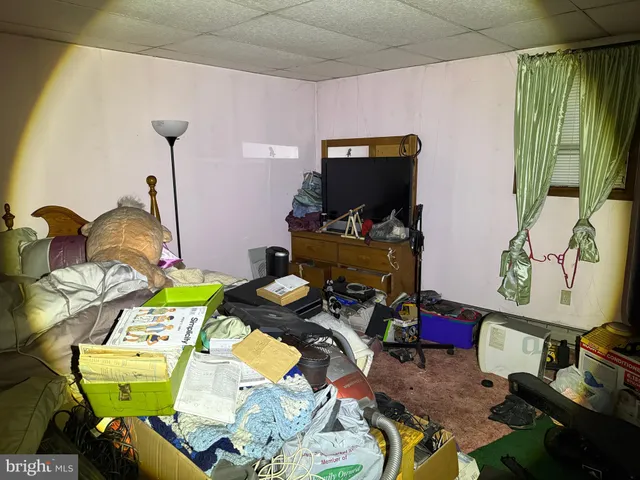 a room with furniture and a flat screen tv