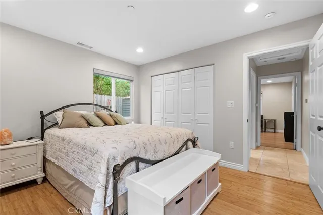 a bedroom with a bed and a dresser