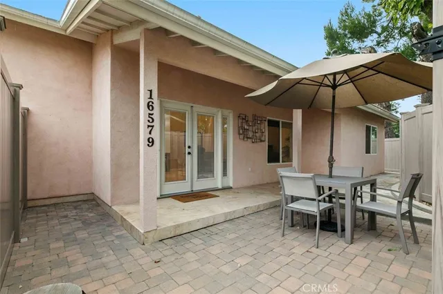 a patio with table and chairs