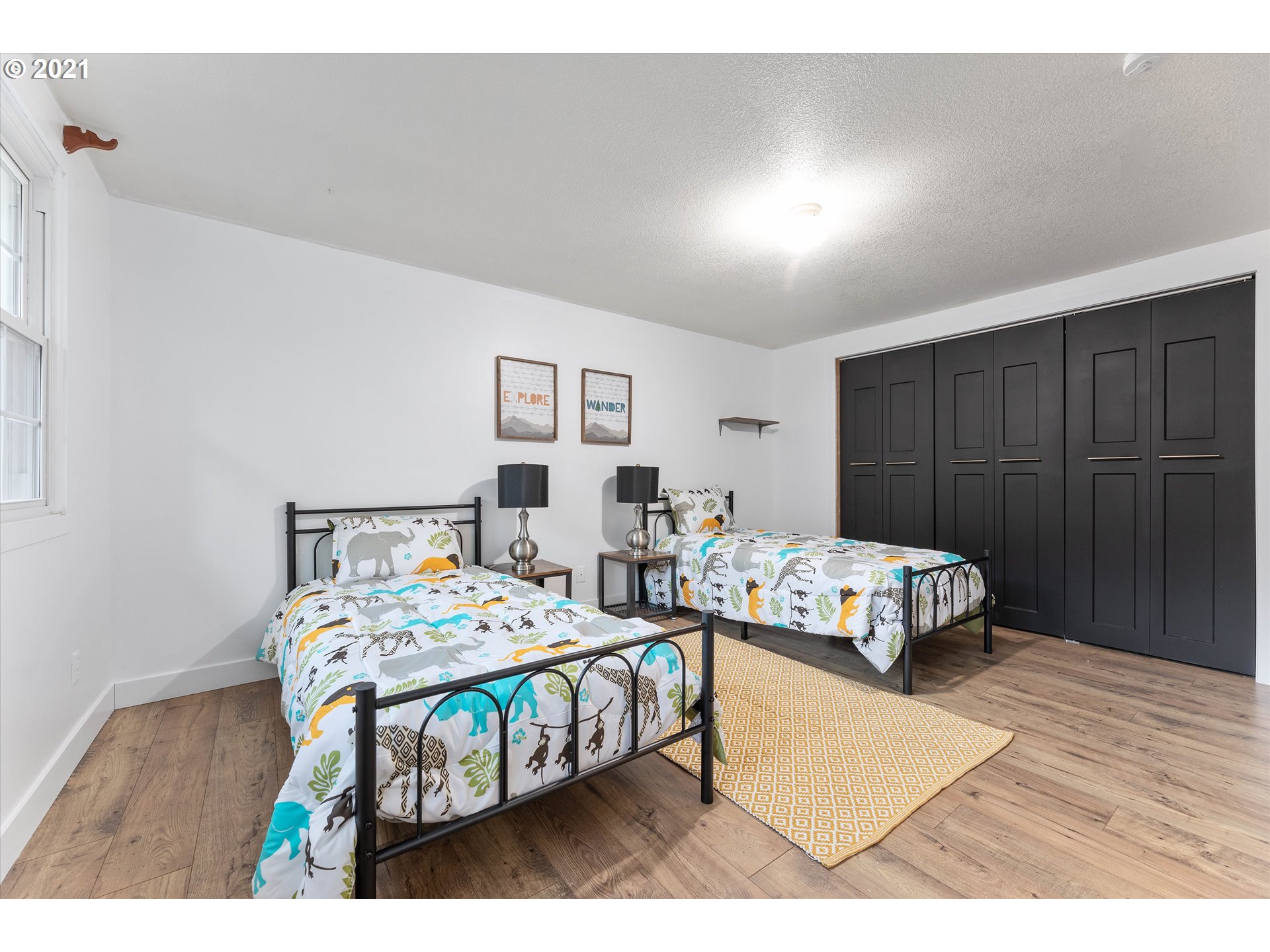 14011 Southeast Rust Way Damascus, OR 97089 - Photo 22 of 32 a bedroom with a bed table and a window