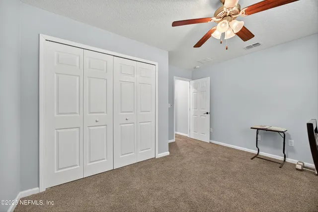 a workspace with furniture and window