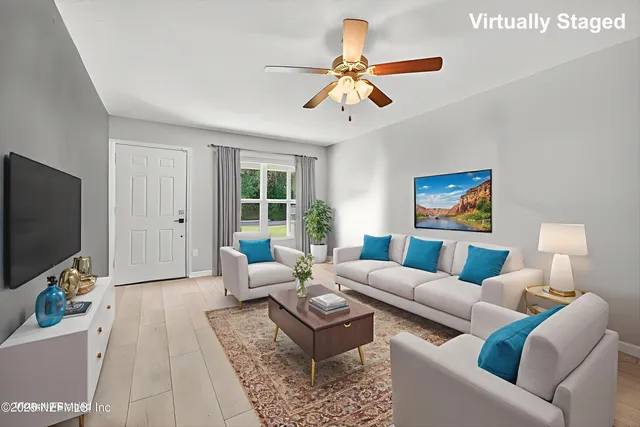 a living room with furniture and a flat screen tv