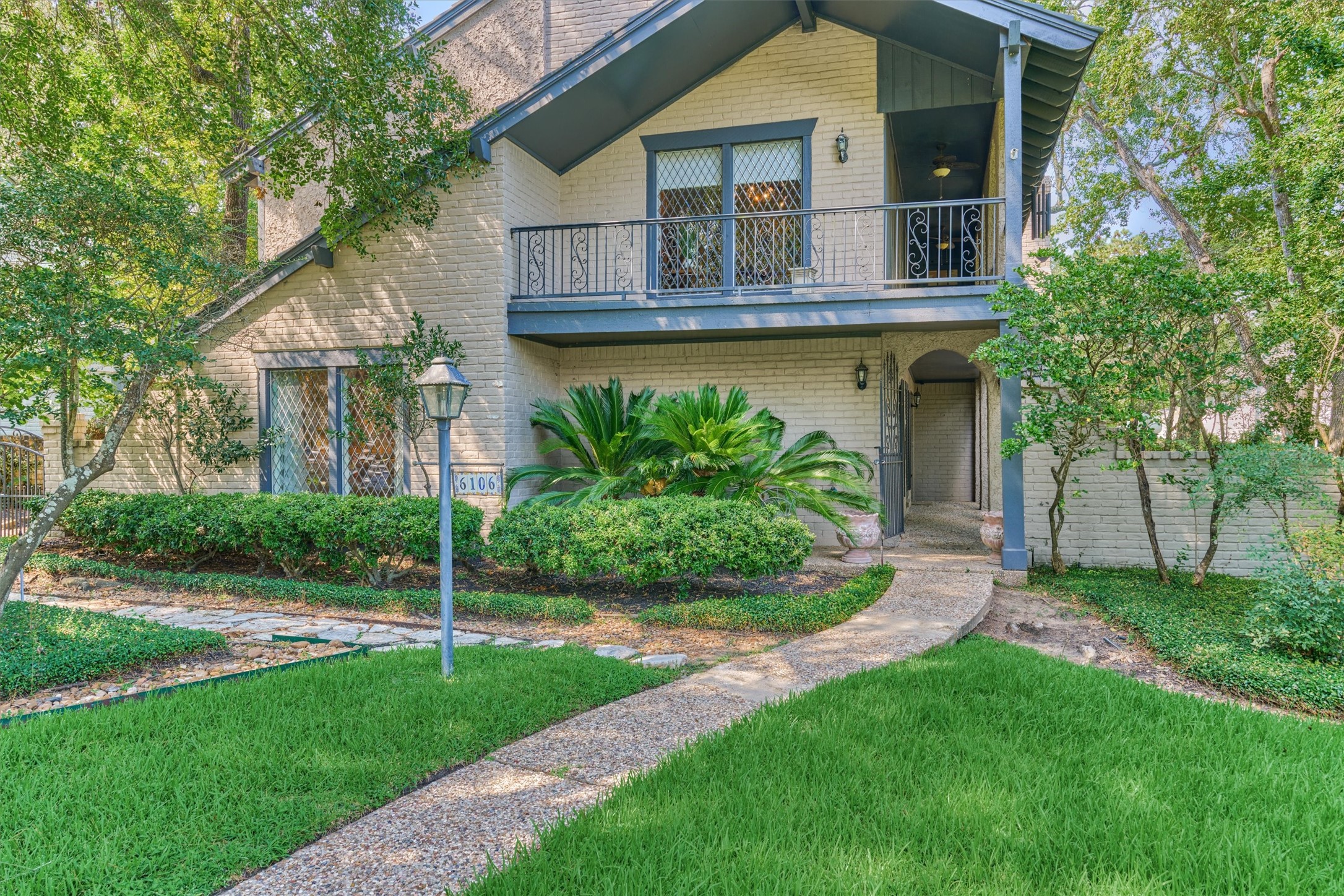 a front view of house with yard and green space