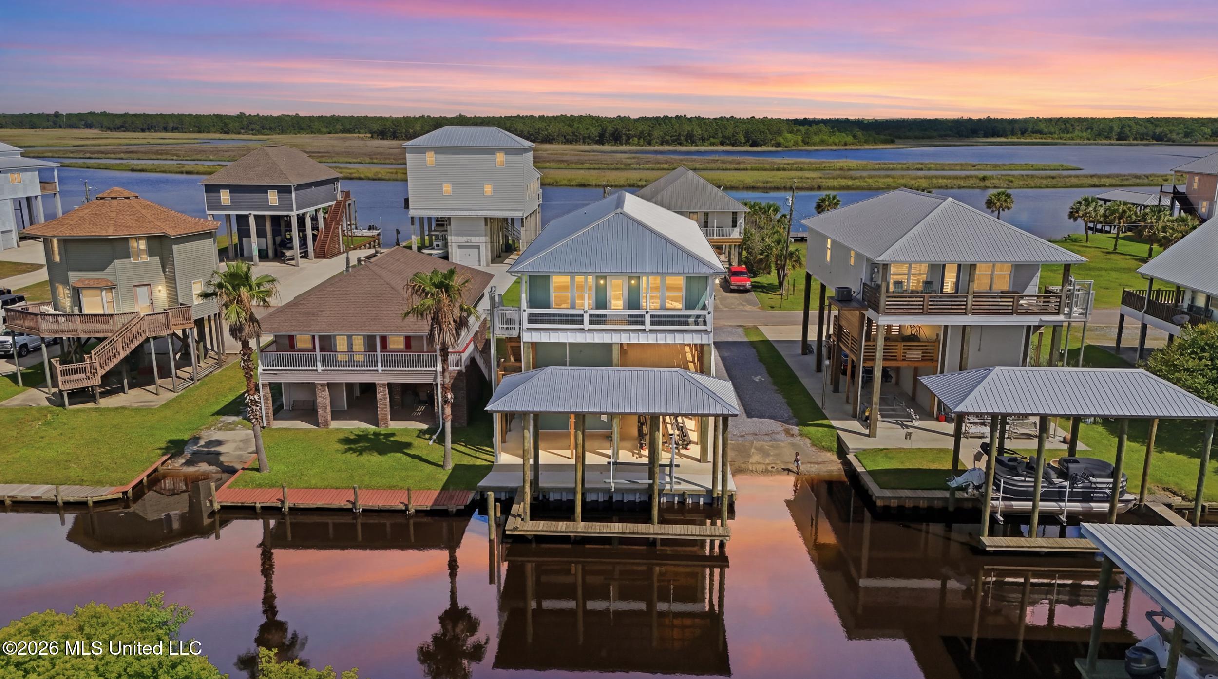 4062 Devon Street Bay St. Louis, MS 39520 - Photo 1 of 70 1_dji_20260611102235_0727_d_twilight_006