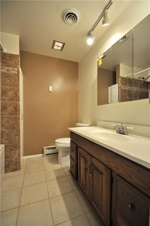 215 Bull Run Road Brownsville, PA 15417 - Photo 15 of 31 a spacious bathroom with a granite countertop sink a toilet and a mirror