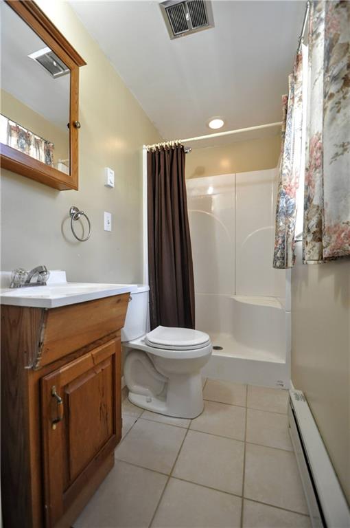 215 Bull Run Road Brownsville, PA 15417 - Photo 19 of 31 a bathroom with a sink a toilet and shower