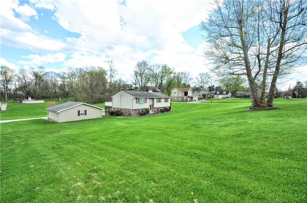 215 Bull Run Road Brownsville, PA 15417 - Photo 2 of 31 a front view of a house with garden