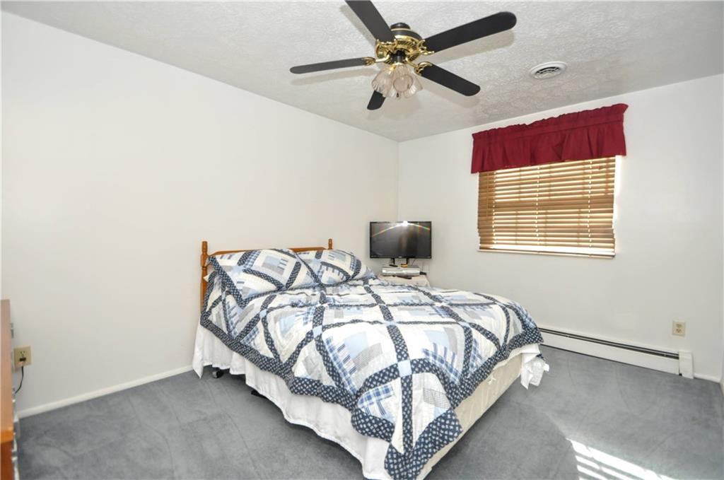 215 Bull Run Road Brownsville, PA 15417 - Photo 21 of 31 a bedroom with a bed and a ceiling fan