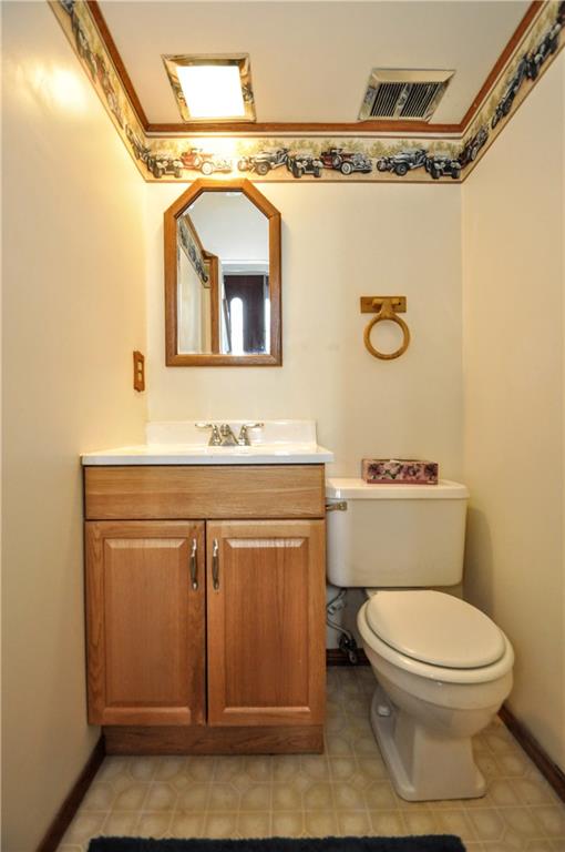 215 Bull Run Road Brownsville, PA 15417 - Photo 25 of 31 a bathroom with a granite countertop toilet sink and mirror