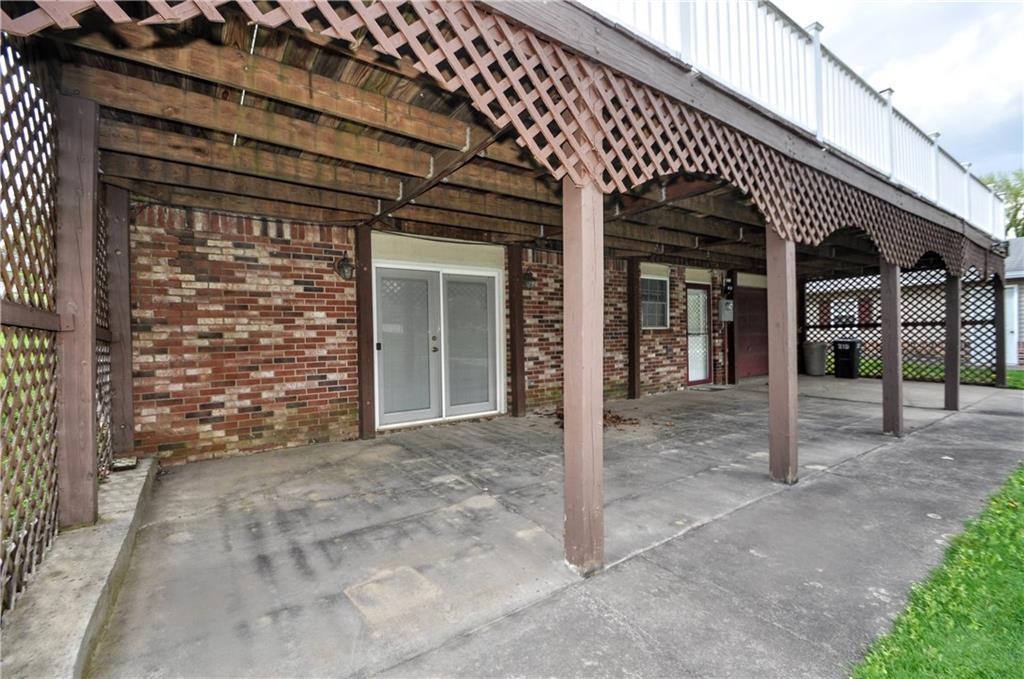 215 Bull Run Road Brownsville, PA 15417 - Photo 29 of 31 a view of a house with a large window and wooden fence