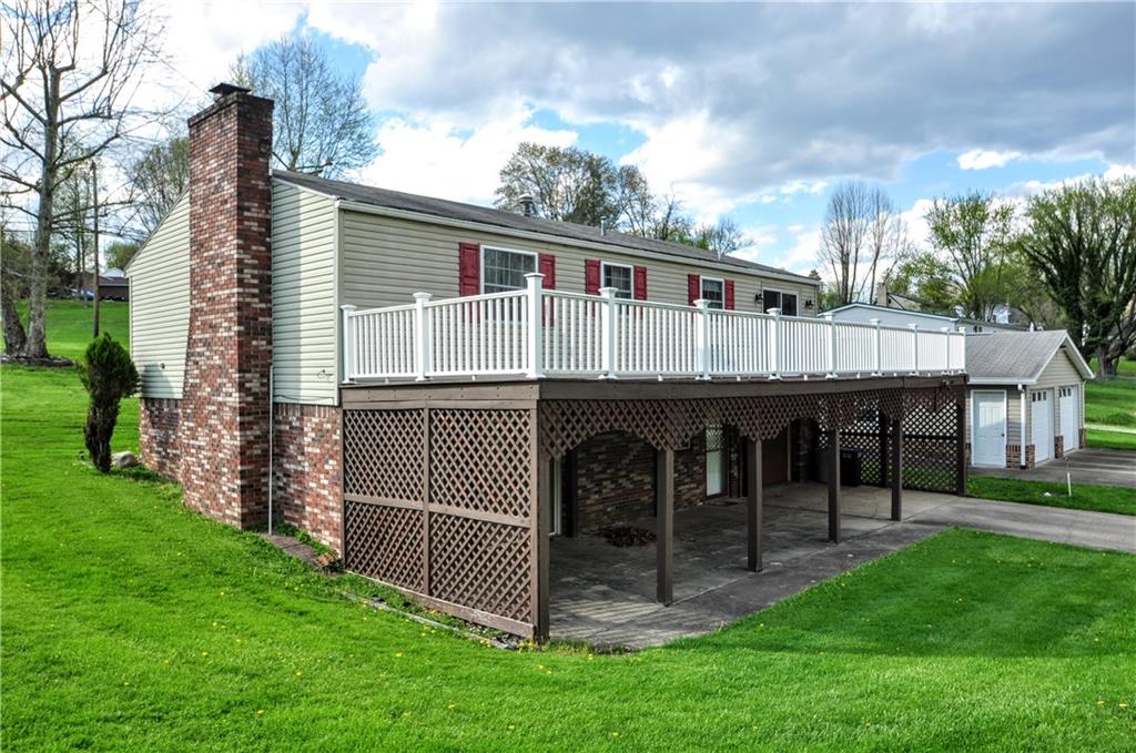 215 Bull Run Road Brownsville, PA 15417 - Photo 30 of 31 a view of a house with a yard and deck